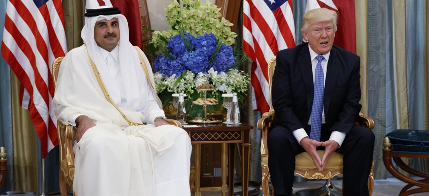  In this May 21, 2017, file photo, President Donald Trump, right, holds a bilateral meeting with Qatar's Emir Sheikh Tamim Bin Hamad Al-Thani, in Riyadh, Saudi Arabia.