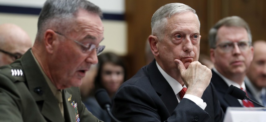 Joint Chiefs Chairman Gen. Joseph Dunford, left, speaks as Defense Secretary Jim Mattis, and Defense Under Secretary and Chief Financial Office David Norquist, listen during a House Armed Services Committee hearing on the FY'18 defense budget.