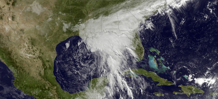 This satellite image taken Tuesday, June 20, 2017, and released by the National Oceanic and Atmospheric Administration shows a tropical storm over the Gulf of Mexico approaching the Gulf Coast. 