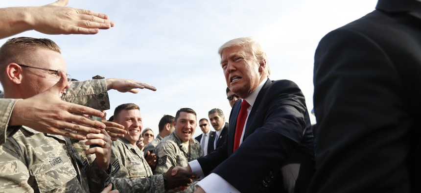 President Donald Trump greets members of the military as he arrives on Air Force One at Harrisburg International Airport in Middletown, Pa., Saturday, April, 29, 2017. 