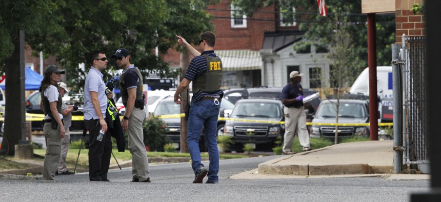 FBI agents investigate the scene at the YMCA in Alexandria, Va., Thursday, June 15, 2017, the day after House Majority Whip Steve Scalise of La. was shot during during a congressional baseball practice nearby.