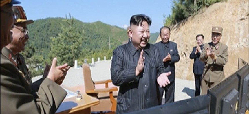 North Korea leader Kim Jung Un, center, applauding after the launch of a Hwasong-14 intercontinental ballistic missile, ICBM, in North Korea's northwest, July 4, 2017.