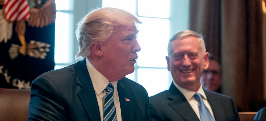 President Donald Trump has delegated decisions over troop levels in Afghanistan to Defense Secretary Jim Mattis (right).