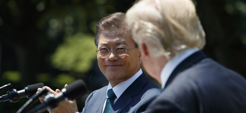 South Korean President Moon Jae-in applauds President Donald Trump after he made a statement in the Rose Garden of the White House in Washington, Friday, June 30, 2017.