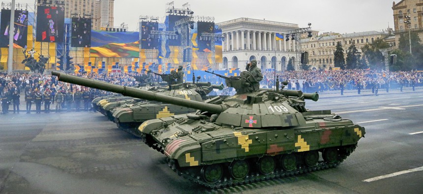 Tanks ride along Khreshchatyk Street, during a military parade to celebrate Independence Day in Kiev, Ukraine, Wednesday, Aug. 24, 2016.