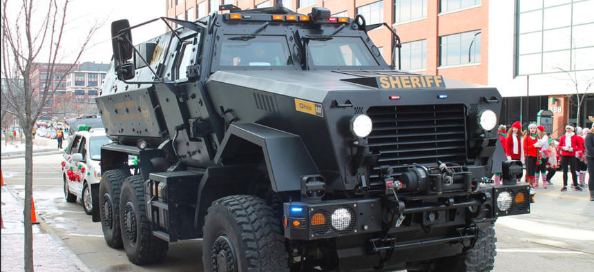 The Pentagon’s 1033 program has distributed billions of dollars worth of weapons, gear, and vehicles like this BAE Systems Caiman MRAP to the Summit County, Ohio, Sheriff’s Department.