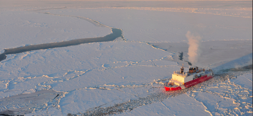 The Kigluaik Mountains are visible as the Coast Guard Cutter Healy breaks ice for the Russian tanker Renda near Nome Jan. 13, 2012.