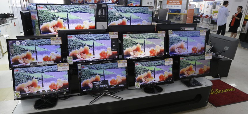 TV screens in an electronics shop display a news program's report on North Korea's missile firing in Seoul, South Korea, Thursday, July 6, 2017.