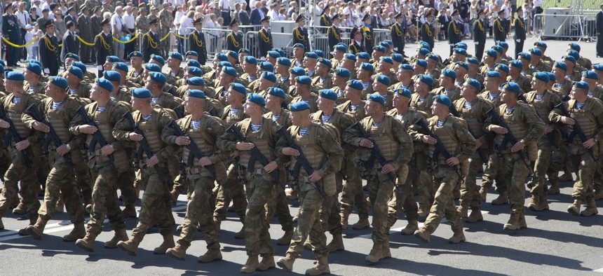 Ukrainian army soldiers march on Khreshchatyk street during military parade on the occasion of Ukraine's Independence Day in the capital Kiev, Ukraine, Monday, Aug. 24, 2015.