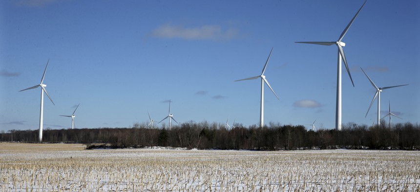 Large energy producing wind turbines that make up Noble Ellenburg Windpark are seen on a harvested cornfield on a farm Sunday, Jan. 15, 2017, in Ellenburg, N.Y.