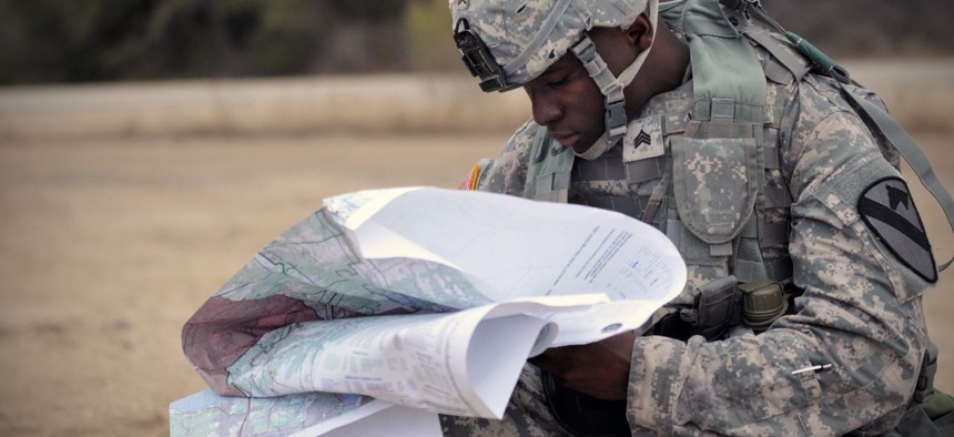 A soldier reviews maps earlier this year at Fort Hood, Texas.