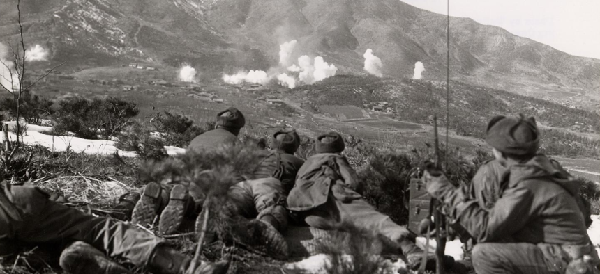 U.S. troops watch as white phosphorus is dropped on Communist positions during the Korean War in 1951.