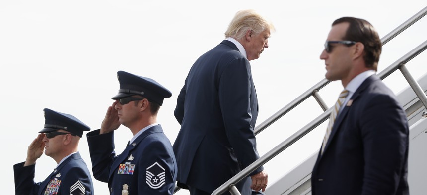 President Donald Trump boards Air Force One at Morristown Municipal Airport, Monday, Aug. 14, 2017 in Morristown, N.J.
