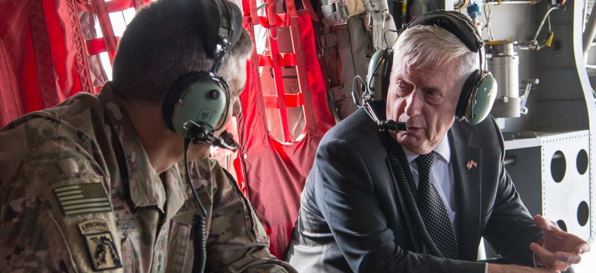 Secretary of Defense Jim Mattis talks with U.S. Army Lt. Gen. Stephen Townsend, the commander of Combined Joint Task Force Operation Inherent Resolve, during a flight in Baghdad, Iraq, Aug. 22, 2017.