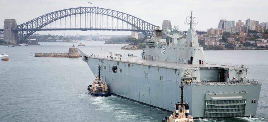 In this 2014 photo, the Royal Australian Navy's Landing Helicopter Dock Canberra passes through Sydney Heads for the first time.