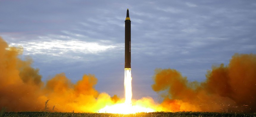A missile is launched during a long and medium-range ballistic rocket launch drill in this photo released by North Korea's Korean Central News Agency in Pyongyang on August 30, 2017. 