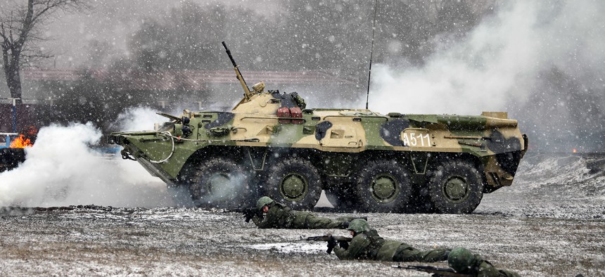 A Russian regiment of rapid deployment forces, with supporting fire of BTR-80, at a 2015 exercise.