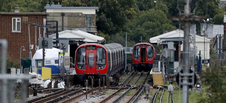 A police forensic tent stands setup on the platform next to the train, at left, on which a homemade bomb exploded at Parsons Green subway station in London, Friday, Sept. 15, 2017. 