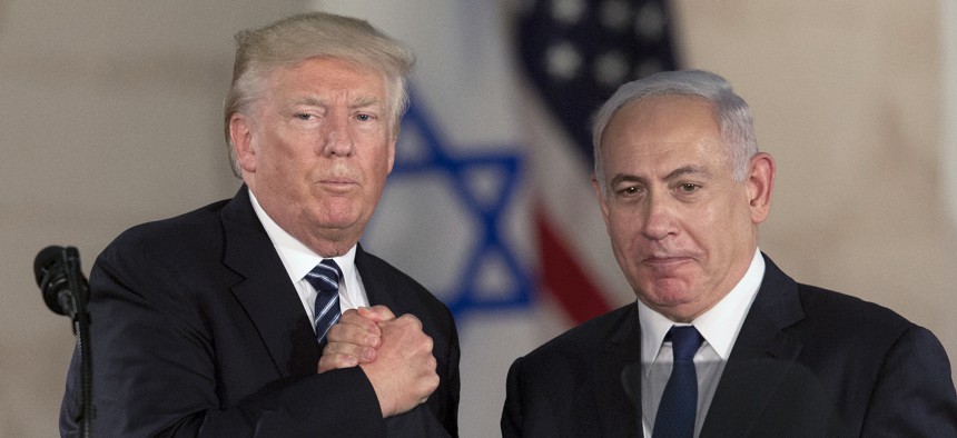 In this May 23, 2017, file photo, U.S. President Donald Trump and Israeli Prime Minister Benjamin Netanyahu shake hands at the Israel museum in Jerusalem.