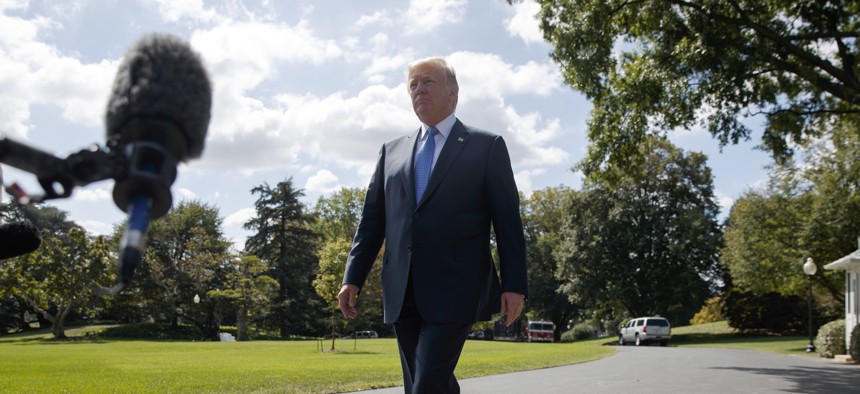 President Donald Trump talks to reporters as he walks to board Marine One on the South Lawn of the White House, Wednesday, Sept. 27, 2017, in Washington.