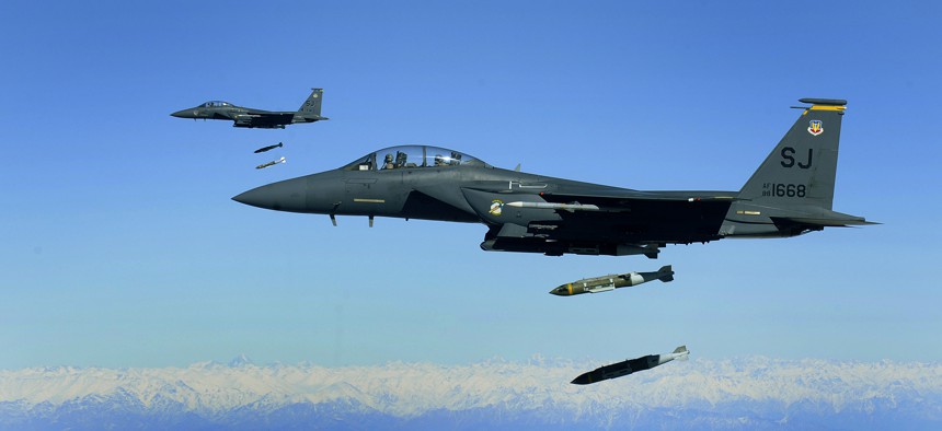 U.S. Air Force F-15E Strike Eagles, from the 335th Expeditionary Fighter Squadron, drop 2,000 pound Joint Direct Attack Munitions on a cave in eastern Afghanistan in 2009.