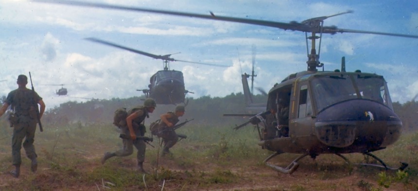 U.S. Army Bell UH-1D helicopters airlift members of the 25th Infantry Division, northeast of Cu Chi, South Vietnam, 1966.