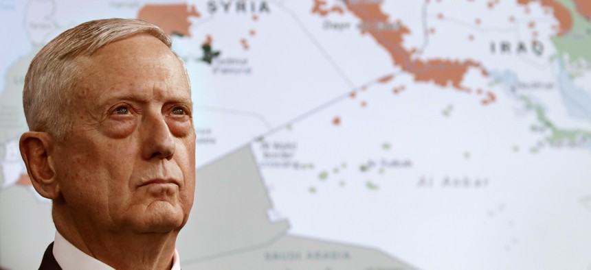 Secretary of Defense Jim Mattis stands in front of a map of Syria and Iraq, while speaking to the media about the Islamic State group, May 19, 2017, at the Pentagon.