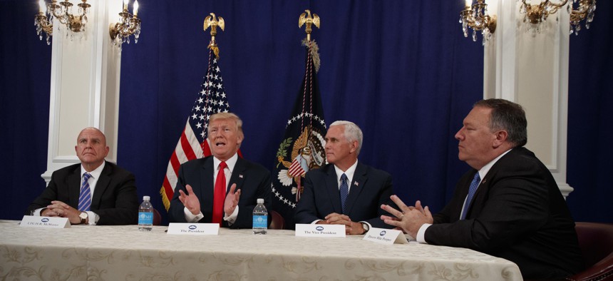 President Donald Trump with, from left, National Security Adviser H.R. McMaster, Vice President Mike Pence, and CIA Director Mike Pompeo, at Trump National Golf Club in Bedminster, N.J., Aug. 10, 2017.