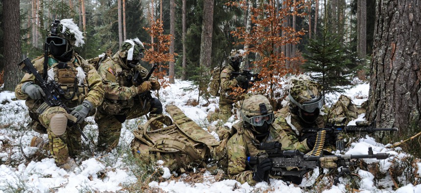173rd Airborne Brigade paratroopers conduct a security halt during a foot patrol at the 7th Army Training Command's Grafenwoehr Training Area, Germany, Jan. 28, 2017.