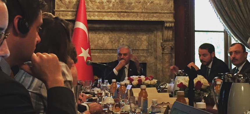 Turkey’s Prime Minister Binali Yildirim speaks to reporters at the Turkish Embassy residence, in Washington, DC, Nov. 8, 2017.