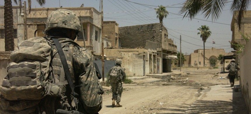 U.S. Army soldiers move toward their next watch location in Baqubah, Iraq in 2007. 
