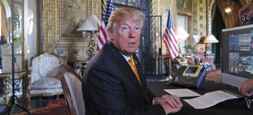 President Donald Trump speaks to the media at his private club, Mar-a-Lago, on Thanksgiving,, Nov. 23, 2017, in Palm Beach, Fla.