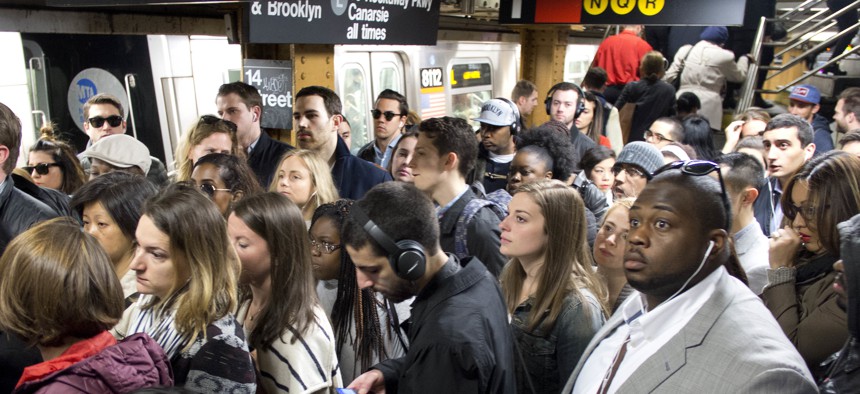 In this May 16, 2016 photo, commuters crowd a platform after exiting the L train in the Union Square subway station in New York.