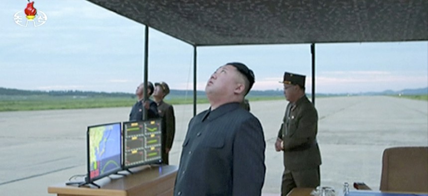 North Korea's Kim Jong Un looks up at the sky at what is said to have been a missile launch on Aug. 29, 2017, at an undisclosed location in North Korea. 