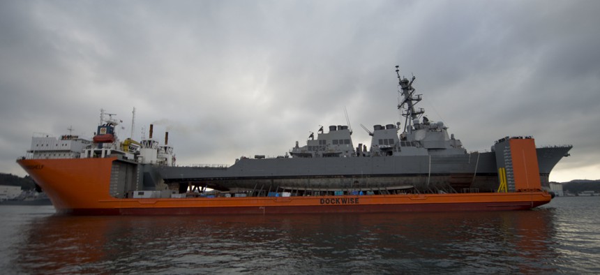 The Arleigh Burke-class guided-missile destroyer USS Fitzgerald aboard the heavy lift transport vessel MV Transshelf before being transported to Huntington Ingalls Industries for repairs.