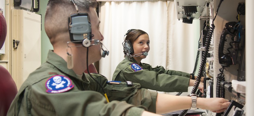 First Lt. Pamela Blanco-Coca and 2nd Lt. John Anderson, simulate key turns of the Minuteman III ICBM in a Launch Control Center on the F.E. Warren Air Force Base Missile Complex in Wyoming.
