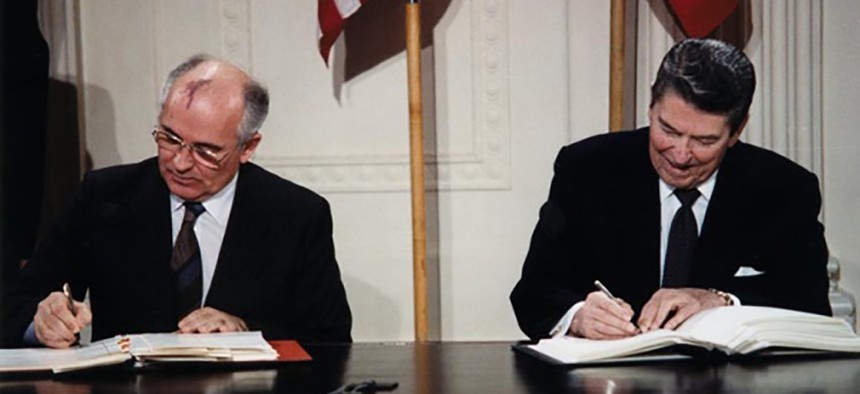 Soviet Leader Mikhail Gorbachev and U.S. president Ronald Reagan sign the Intermediate-Range Nuclear Forces Treaty on December 8, 1987. 