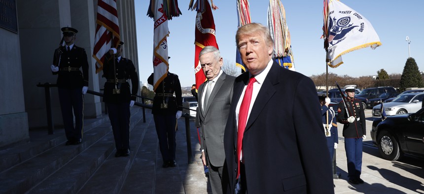 President Donald Trump walks into the Pentagon with Defense Secretary Jim Mattis on his arrival to the Pentagon, Thursday, Jan. 18, 2018.