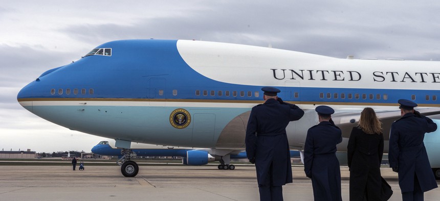Airmen salute as Air Force One departs Joint Base Andrews.