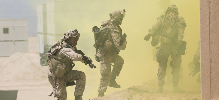 Marines with 2nd Battalion, 7th Marine Regiment, enter a building during an urban assault at Range 200 aboard Marine Corps Air Ground Combat Center, Twentynine Palms, California, May 16, 2017