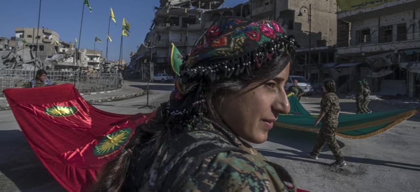 Women of the YPJ celebrate their defeat of ISIS in Raqqa, Syria, Thurs., Oct. 19, 2017.