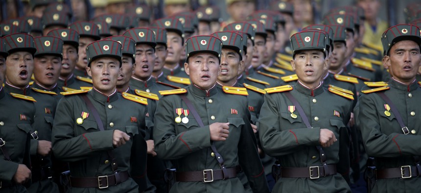 North Korean soldiers, wearing historical uniforms, parade in Pyongyang, North Korea, on Oct. 10, 2015. 