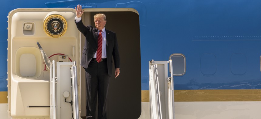 U.S. President Donald Trump waves goodbye after visiting Marine Corps Air Station Yuma, Arizona.