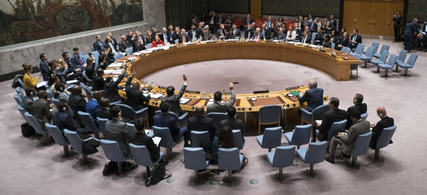 Members of the United Nations Security Council vote on a resolution demanding a 30-day humanitarian cease-fire across Syria, Saturday, Feb. 24, 2018 at United Nations headquarters. 