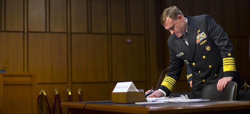 Director of the National Security Agency (NSA) Adm. Michael Rogers takes notes on Capitol Hill, Thursday, Sept. 24, 2015, prior to testifying before the Senate Intelligence Committee.