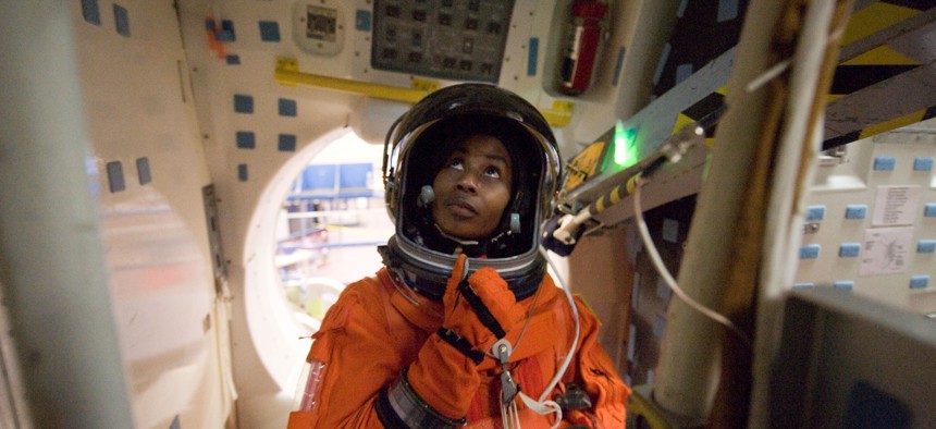 NASA astronaut Stephanie Wilson is attired in a training version of her shuttle launch and entry suit in a 2009 training mission.