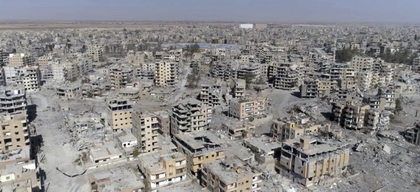 A frame grab made from drone video shows damaged buildings in Raqqa, Syria, Oct. 19, 2017.
