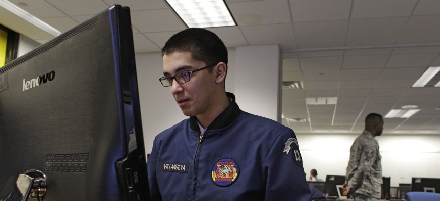 In this Feb. 20, 2013 photo, a cadet works at a large computer display inside a classroom at the Center for Cyberspace Research, where cyber warfare is taught, at the U.S. Air Force Academy, in Colorado Springs, Colo. 
