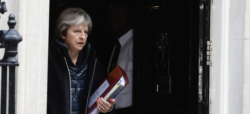 Britain's Prime Minister Theresa May leaves 10 Downing Street to attend the weekly Prime Ministers' Questions session, in parliament in London, March 14, 2018. 