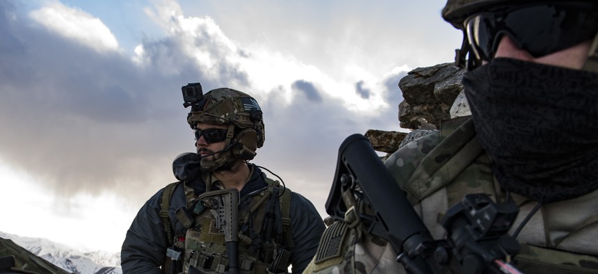 U.S. Air Force pararescuemen, assigned to the 83rd Expeditionary Rescue Squadron, survey the landscape during a training exercise at an undisclosed location in the mountains of Afghanistan, March 14, 2018. 